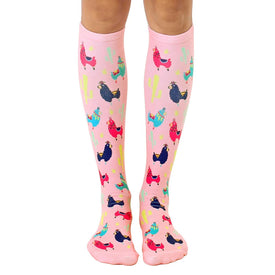 knee high women's pink socks with multicolored party-ready patterned flamingos.  