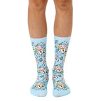 Pair of pastel blue crew socks with a repeating pattern of Maneki Neko (beckoning cat) illustrations and white flowers. [lf]