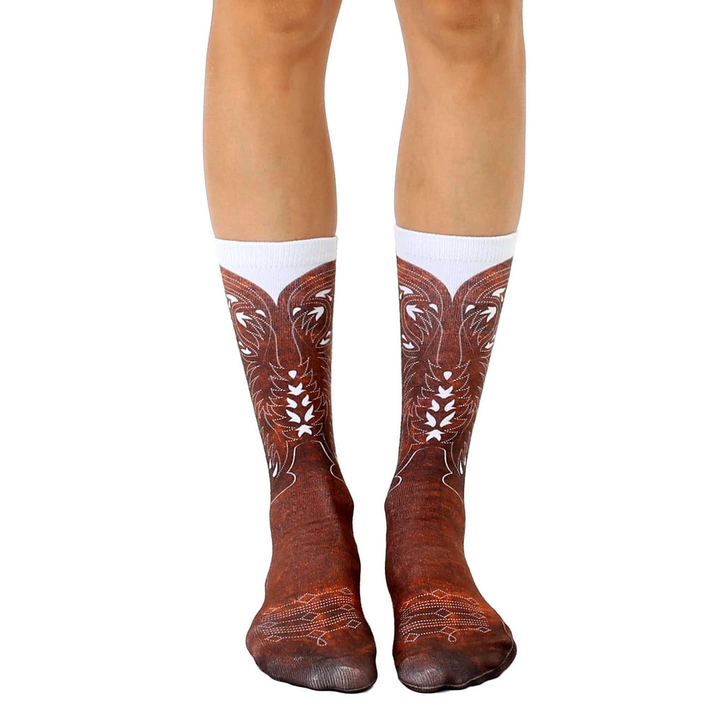 Pair of brown and white crew socks featuring a cowboy boot design. [lf]