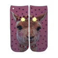 Close-up of the Girly Llama Glow socks in the dark, showcasing the glow-in-the-dark elements. [lf]