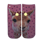 Close-up of the Girly Llama Glow socks in the dark, showcasing the glow-in-the-dark elements. [lf]
