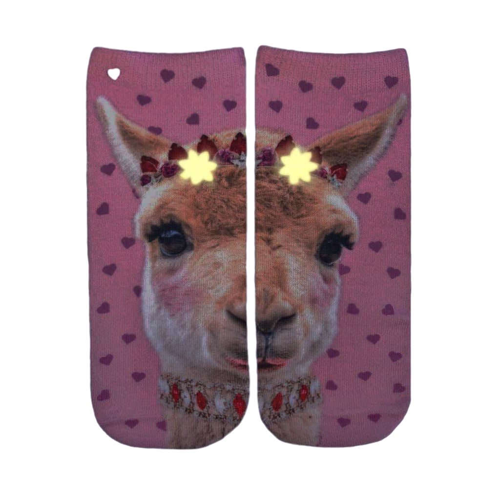 Close-up of the Girly Llama Glow socks in the dark, showcasing the glow-in-the-dark elements. [lf]