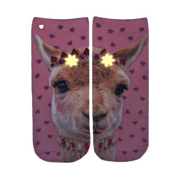 Close-up of the Girly Llama Glow socks in the dark, showcasing the glow-in-the-dark elements. [lf]