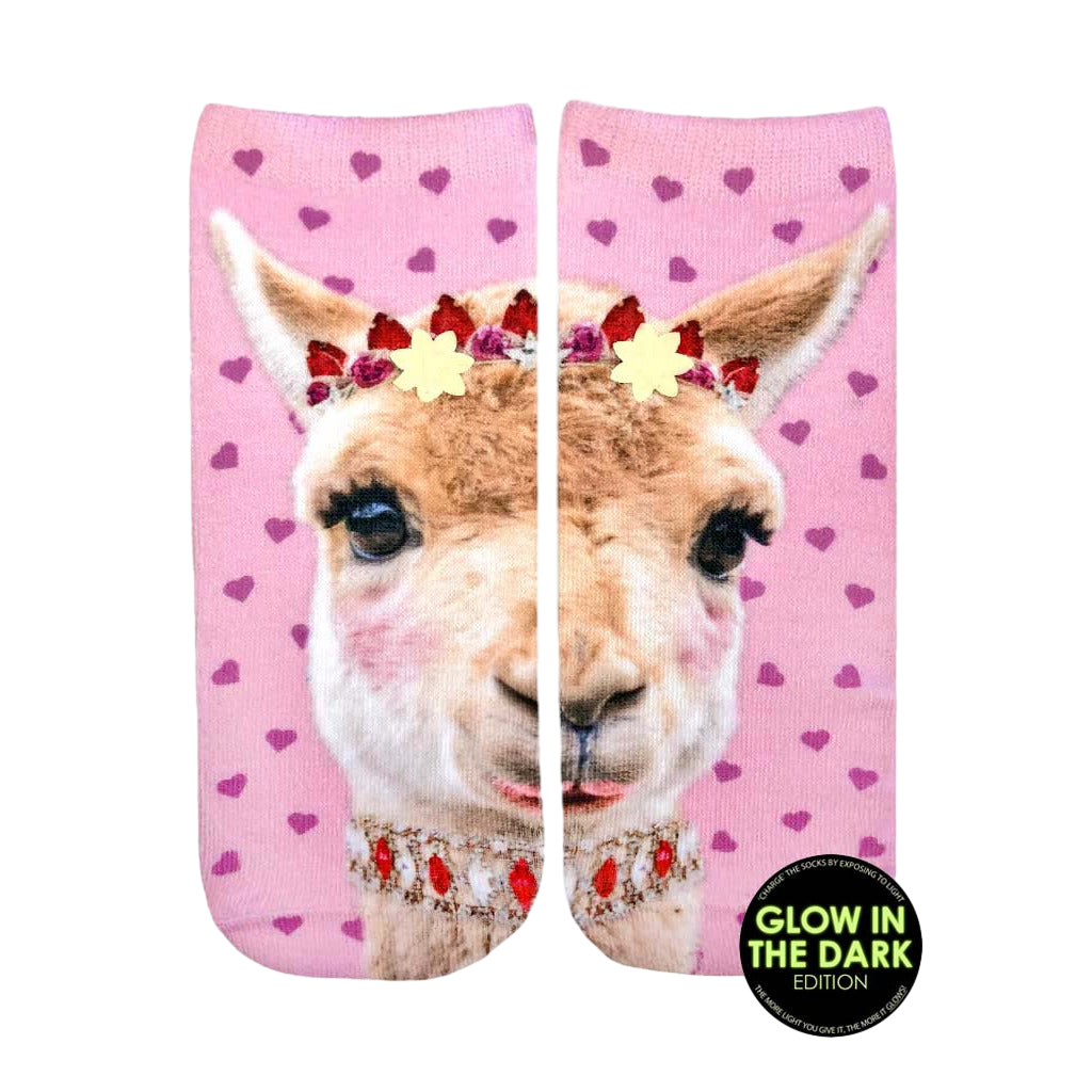 Ankle socks featuring a pink llama with a flower crown and jeweled necklace on a pink background with pink hearts. Glow-in-the-dark details. [lf]