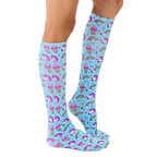 Lifestyle shot showing the Unicorn Party knee-high socks on a person's legs, showcasing how they look when worn. [lf]