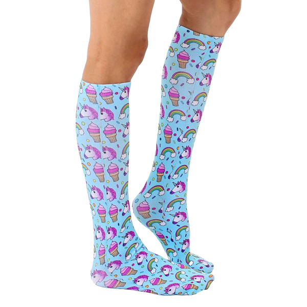 Lifestyle shot showing the Unicorn Party knee-high socks on a person's legs, showcasing how they look when worn. [lf]