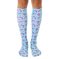 Pair of pastel blue knee-high socks with an all-over print of unicorns, rainbows, and ice cream cones. [lf]