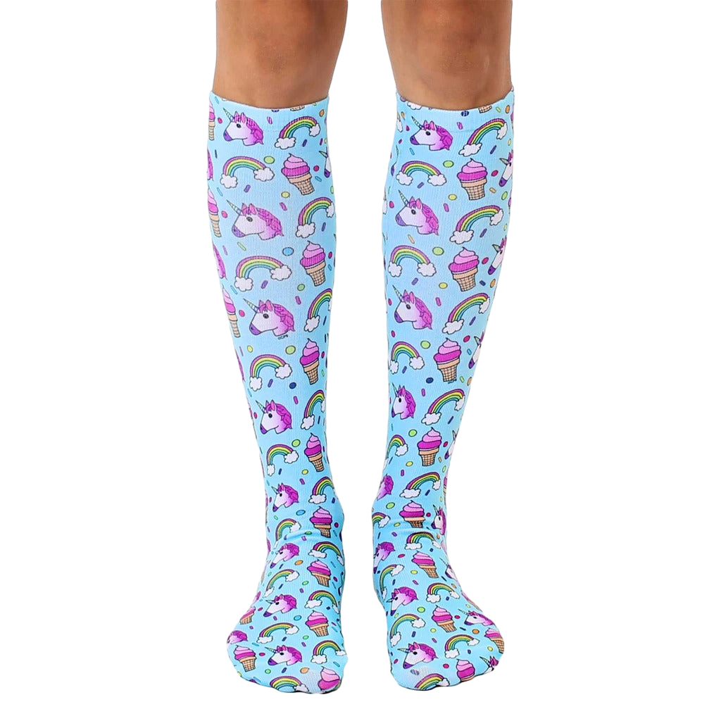 Pair of pastel blue knee-high socks with an all-over print of unicorns, rainbows, and ice cream cones. [lf]