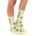 Lifestyle shot of a person's legs wearing the Tree Sloth socks, showing them styled with casual footwear. [lf]