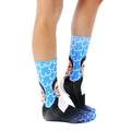 Lifestyle shot: Person wearing the Ruth Bader Ginsburg socks, showing them from the knees down. [lf]
