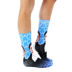 Lifestyle shot: Person wearing the Ruth Bader Ginsburg socks, showing them from the knees down. [lf]
