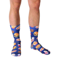 Lifestyle shot of a person wearing the Fast Food Galaxy socks. The socks' design is visible against the person's legs and skin tone. [lf]