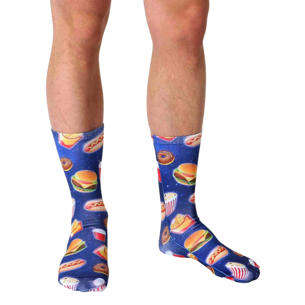Lifestyle shot of a person wearing the Fast Food Galaxy socks. The socks' design is visible against the person's legs and skin tone. [lf]
