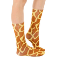 Lifestyle shot of a person wearing the giraffe print socks, showing how they look when worn. [lf]