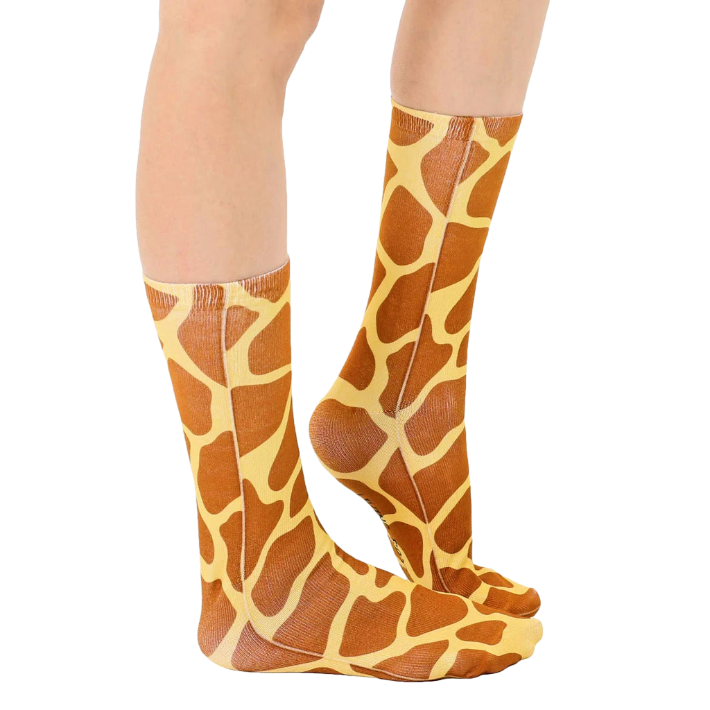 Lifestyle shot of a person wearing the giraffe print socks, showing how they look when worn. [lf]