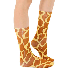A pair of socks with a giraffe print.