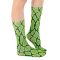 Lifestyle shot of a person wearing lime green and black snakeskin print crew socks. [lf]