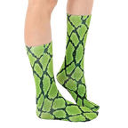 Lifestyle shot of a person wearing lime green and black snakeskin print crew socks. [lf]