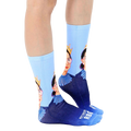 Lifestyle shot of a person wearing the Notorious RBG crew socks. The socks are shown from the side. [lf]