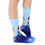 Lifestyle shot of a person wearing the Notorious RBG crew socks. The socks are shown from the side. [lf]