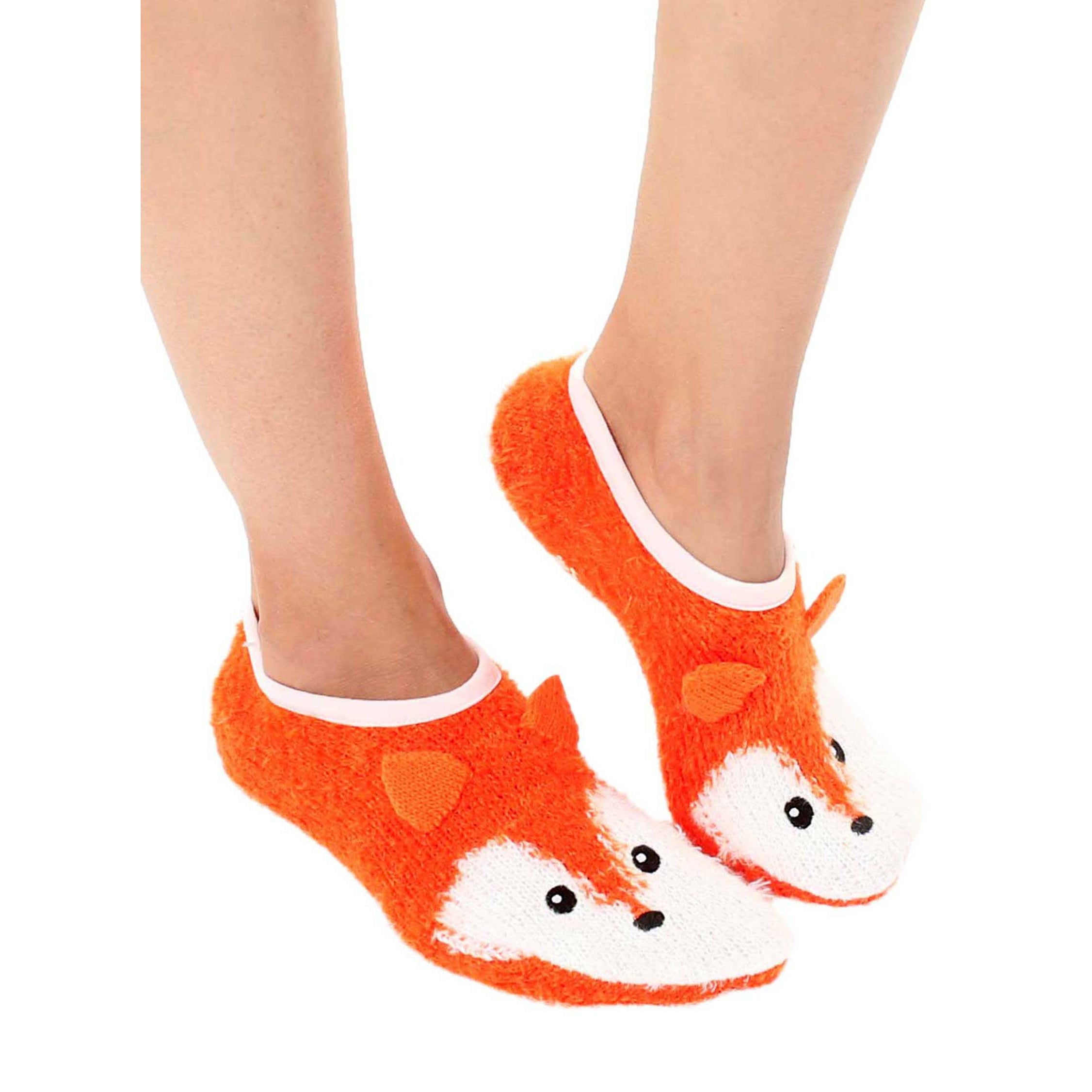 Another lifestyle shot showcasing the fuzzy fox slipper socks on a person's feet; highlights the socks' non-slip feature. [lf]