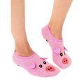 Lifestyle shot of a person's feet wearing a pair of pink fuzzy pig slipper socks with non-skid bottoms. [lf]
