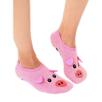 Lifestyle shot of a person's feet wearing a pair of pink fuzzy pig slipper socks with non-skid bottoms. [lf]