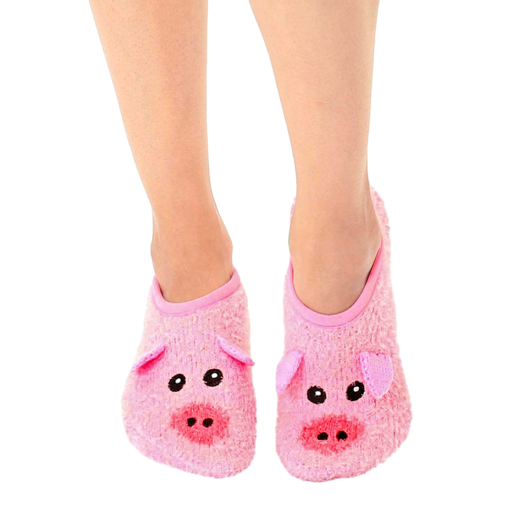 Pair of pink fuzzy slipper socks with pig faces.  Features non-slip grips on the soles. [lf]