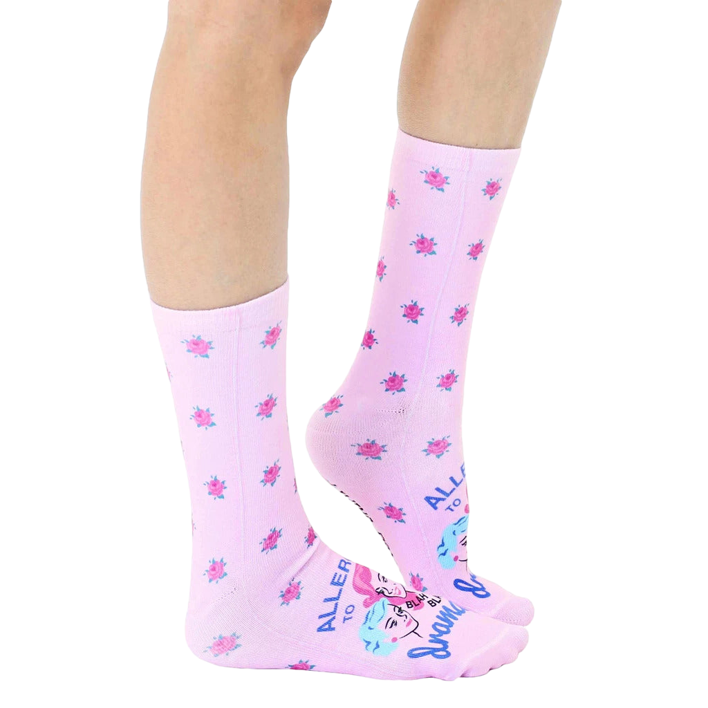 Lifestyle shot of 'Allergic To Drama' socks on a model's legs, showing the socks' fit and pattern on the leg. [lf]