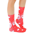 Lifestyle shot showing 'Hot Mess' socks on a person's legs, highlighting the sock's fit and design in a casual setting. [lf]