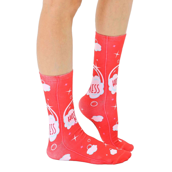 Lifestyle shot showing 'Hot Mess' socks on a person's legs, highlighting the sock's fit and design in a casual setting. [lf]
