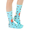 Lifestyle shot of Instant Human coffee socks on a person's feet, showcasing how they look when worn. [lf]