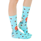 Lifestyle shot of Instant Human coffee socks on a person's feet, showcasing how they look when worn. [lf]