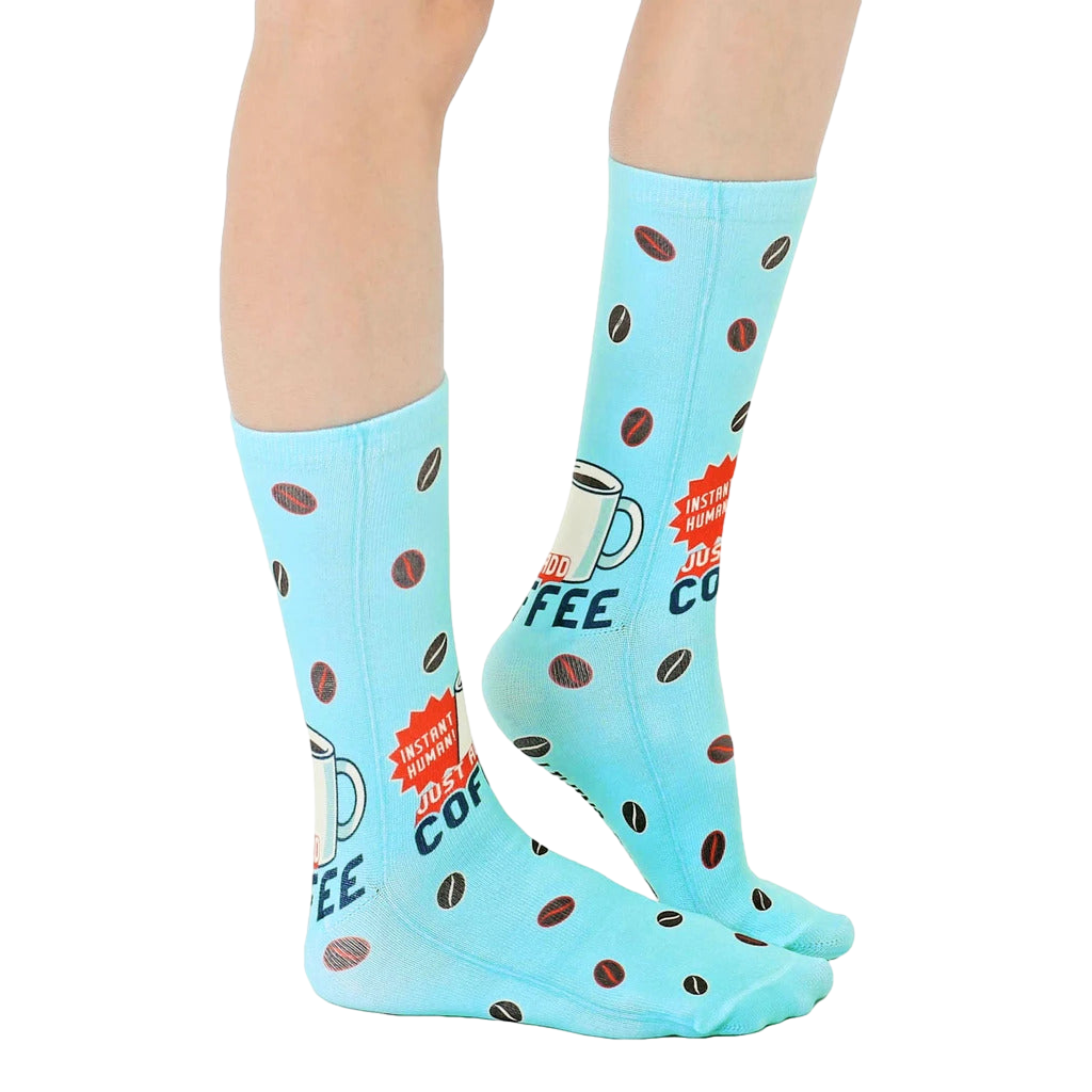 Lifestyle shot of Instant Human coffee socks on a person's feet, showcasing how they look when worn. [lf]