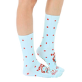 Lifestyle shot of a person wearing the light blue crew socks with red stars and a humorous parenting quote. [lf]