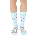 A pair of light blue crew socks with red stars and a humorous parenting quote featuring illustrated faces at the bottom. [lf]