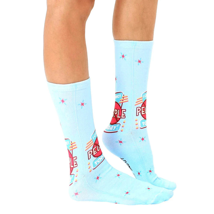 A pair of blue socks with red stars and the words 