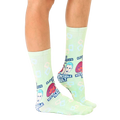 Lifestyle shot of a person wearing the 'Responsible Adult' socks, showcasing the fit and style. [lf]