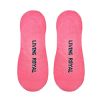 Flat lay product shot showing the bottom of the pink no-show socks with 'Living Royal' printed on the soles.