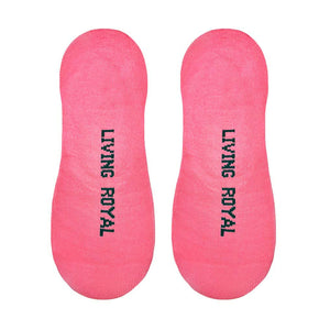 A pair of pink no-show socks with the words 