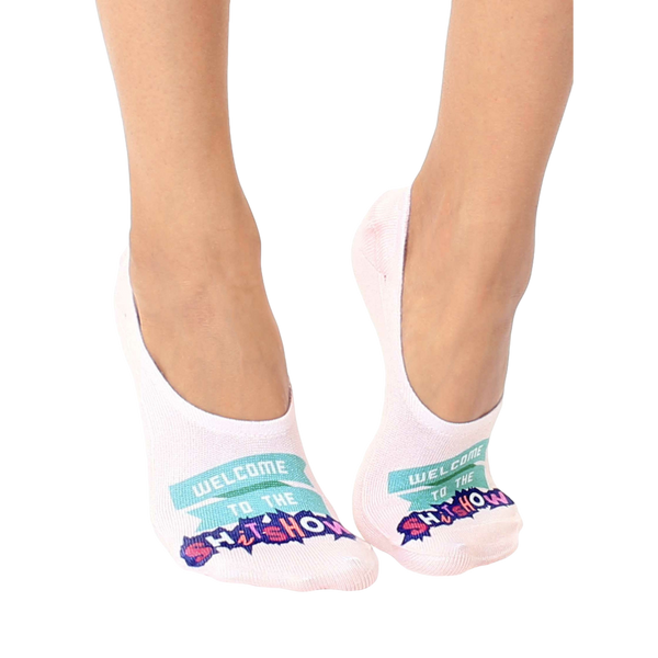 Pair of women's no-show socks in off-white. Feature a teal banner reading 'Welcome to the Shitshow' in a playful font. [lf]