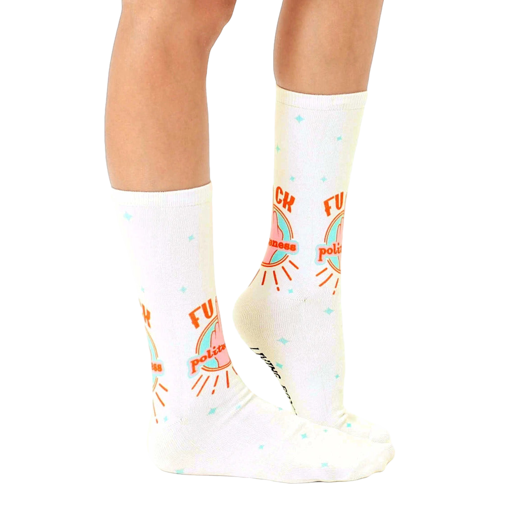 Lifestyle shot of a person modeling the 'F*ck Politeness' socks, showcasing how they look when worn. [lf]