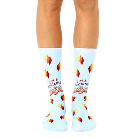 light blue crew socks with a pattern of yellow, orange, and red diamonds with the text "i'm a fucking delight".   