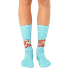 A pair of light blue crew socks with a 'Don't Be A Prick' slogan, cacti, and small eye illustrations. [lf]