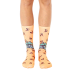 A pair of peach-colored crew socks with a teal 'Adulting is BS' graphic and small fortune cookie designs. Fun and comfy! [lf]