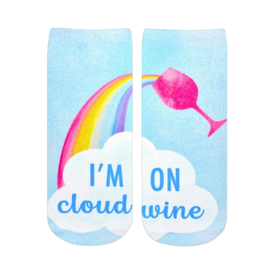 Ankle socks with a pastel blue background, rainbow, pink wine glass, and 'I'm on Cloud Wine' text on a white cloud.