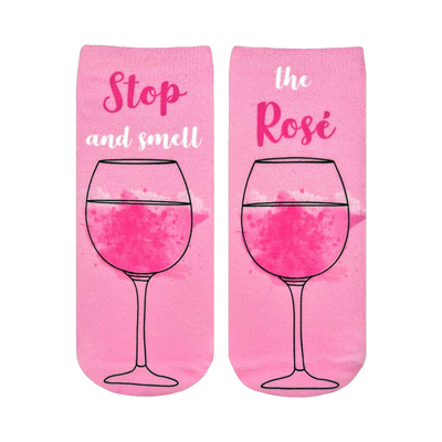 Pair of pink ankle socks featuring a rosé wine glass graphic and the text 'Stop and smell the Rosé'.