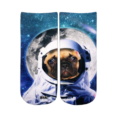Crew socks featuring a tan pug dog wearing an astronaut suit against a dark blue space background with a large moon.