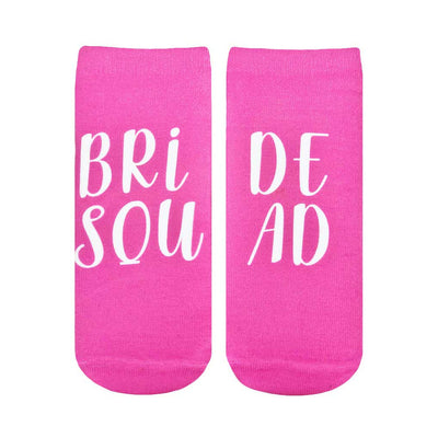 white text on pink socks reads "bride squad"; perfect for a wedding.   