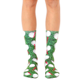 A pair of crew golf socks with a playful design.  The socks are mainly green with white golf balls and red tees. [lf]